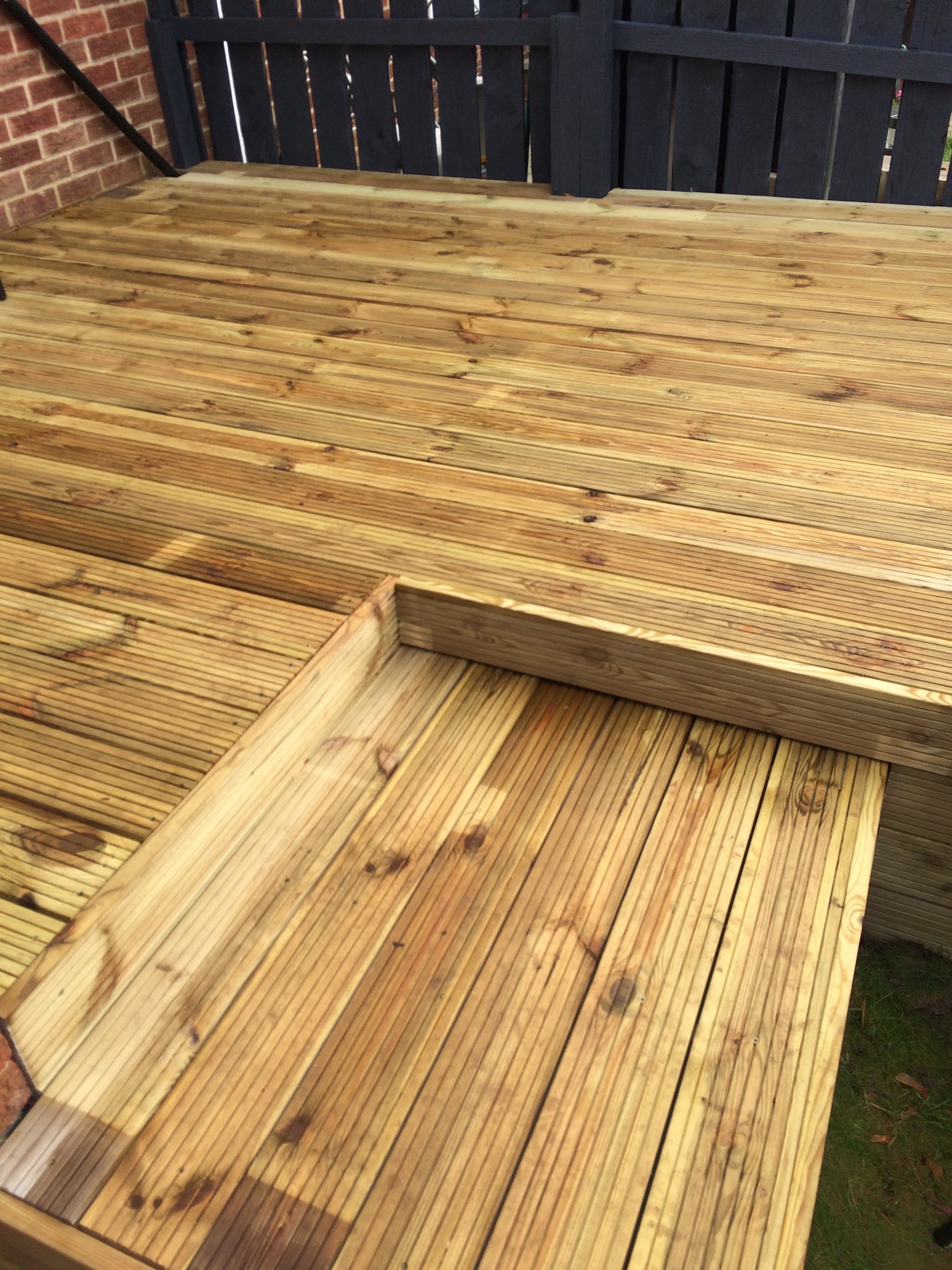 Close-up of new decking boards and a neatly finished step edge